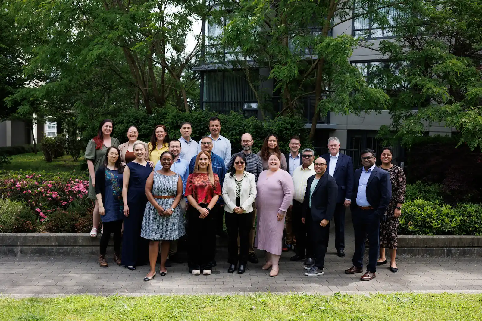 Group of CHF BC staff posing together outdoors in front of a building